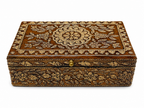 Raised front view showing the ornate lid and floral border