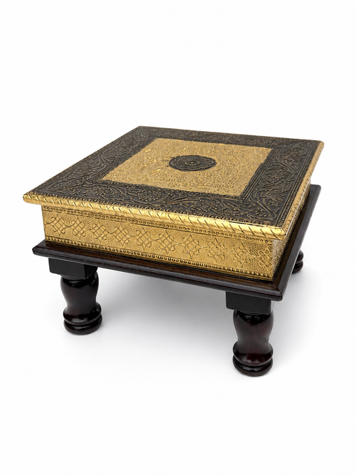 Angled view of antique gold floral embossed puja chowki