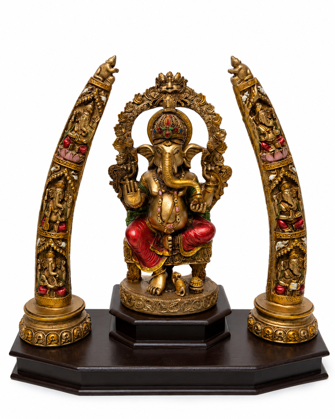 Front view of antique gold Ganesha idol with ornate tusk-style side arches