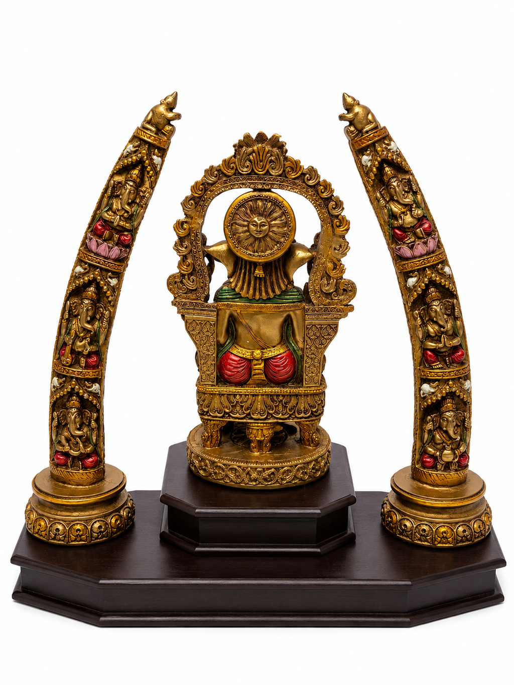 Rear view of antique gold Ganesha idol and ornate decorative arches