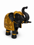 Front angled view of ornate black and gold elephant sculpture