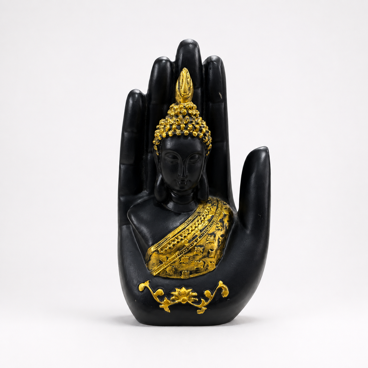 Black and gold Buddha figure framed within a blessing palm sculpture, front view
