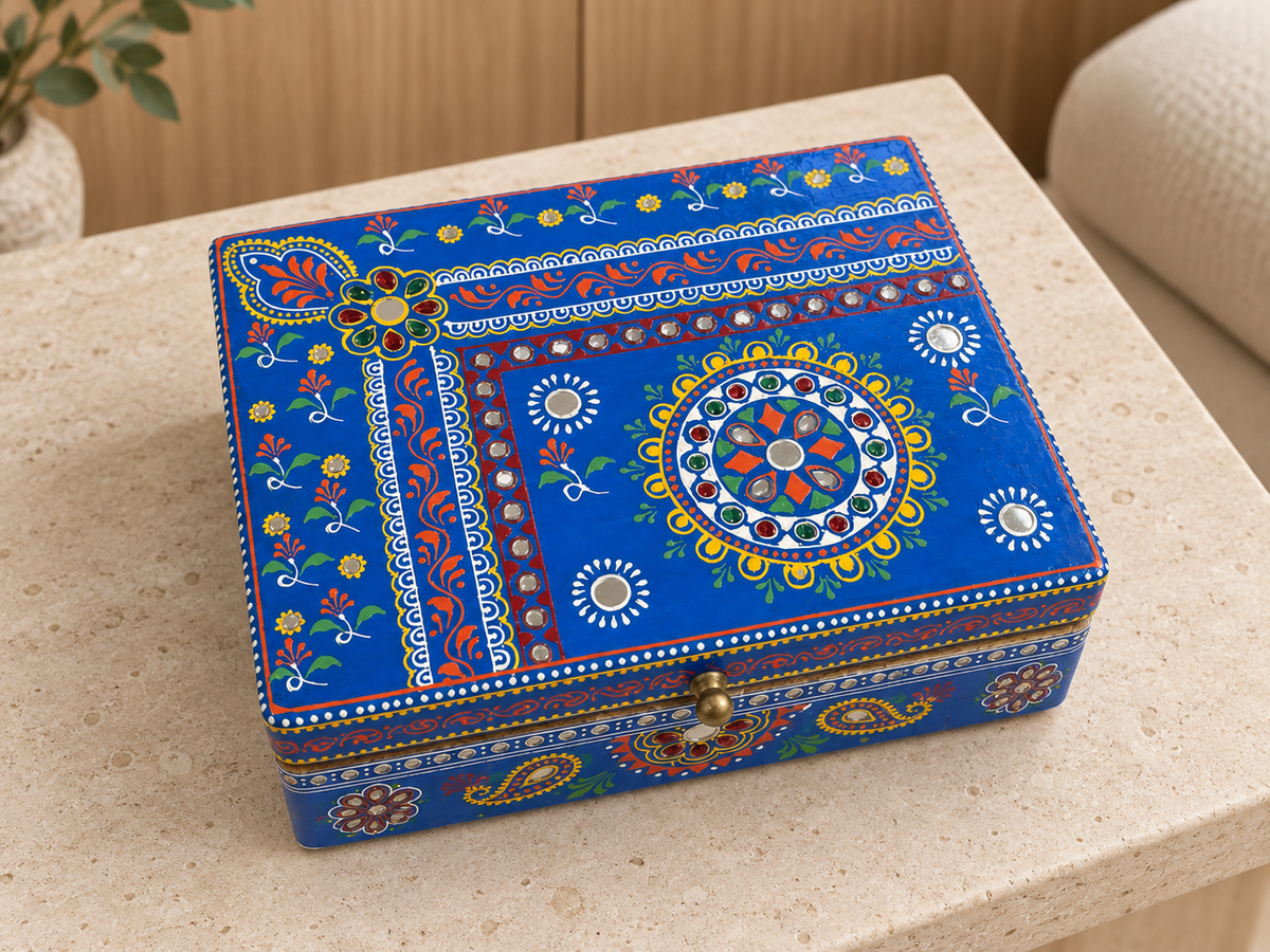 Cobalt Bloom keepsake box displayed on a pale stone table