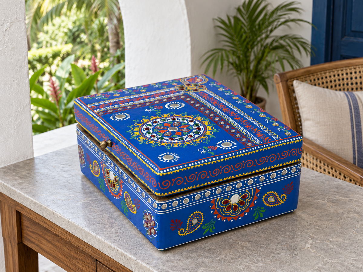 Cobalt Bloom keepsake box displayed on a console beside a blue doorway
