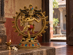 Nataraj Shiva idol displayed in a warm heritage prayer alcove