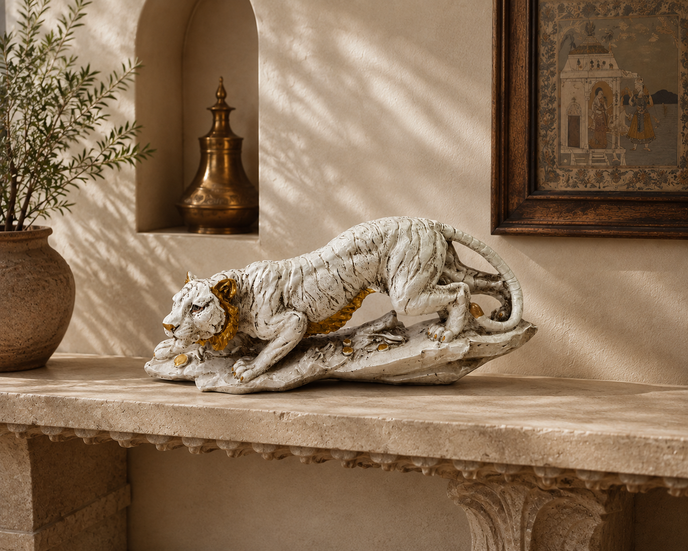 Crouching Majesty ivory and gold tiger sculpture styled on a console