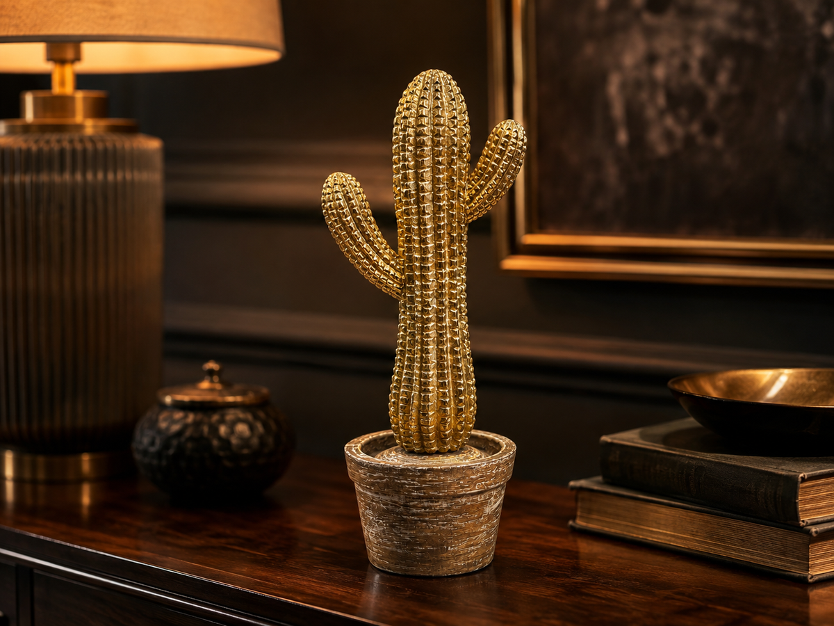 Desert Gleam golden cactus sculpture styled in a warm dark interior