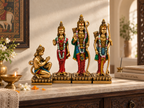 Ram Darbar idol set arranged with flowers, a lamp and incense in a warm devotional display