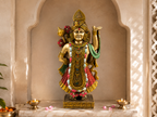 Divine Grace Shrinathji idol in a light arched prayer alcove with lamps and pink petals