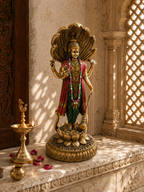 Vishnu idol beneath a serpent canopy displayed in a carved shrine setting beside a diya and flower petals