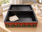 Open Emerald Darbar keepsake box holding letters on a dressing table