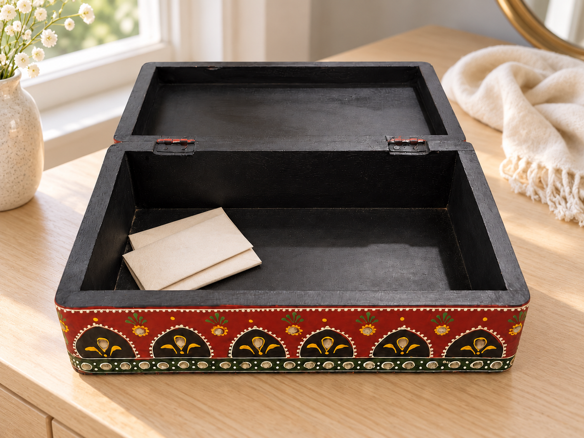 Open Emerald Darbar keepsake box holding letters on a dressing table