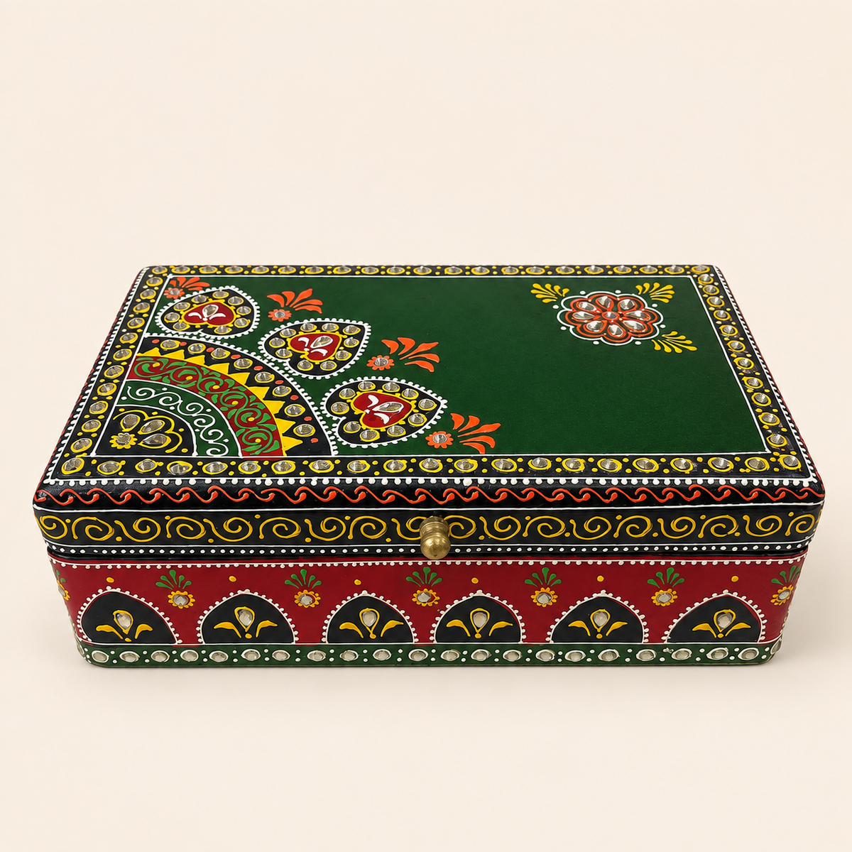 Angled view of Emerald Darbar keepsake box showing the decorated green lid and scroll borders