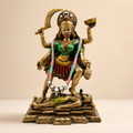 Fierce Grace Maa Kali idol with gold-tone detailing, green and red attire, standing above a reclining Shiva figure, front view