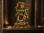 Maa Kali idol displayed in a dark stone shrine beside a lamp and white flowers
