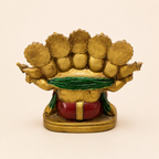 Rear view of the five-faced Ganesha idol showing the crown backs, green drape, red clothing and broad pedestal