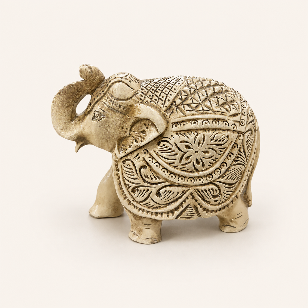 Floral Majesty ivory and gold raised-trunk elephant sculpture, front side view