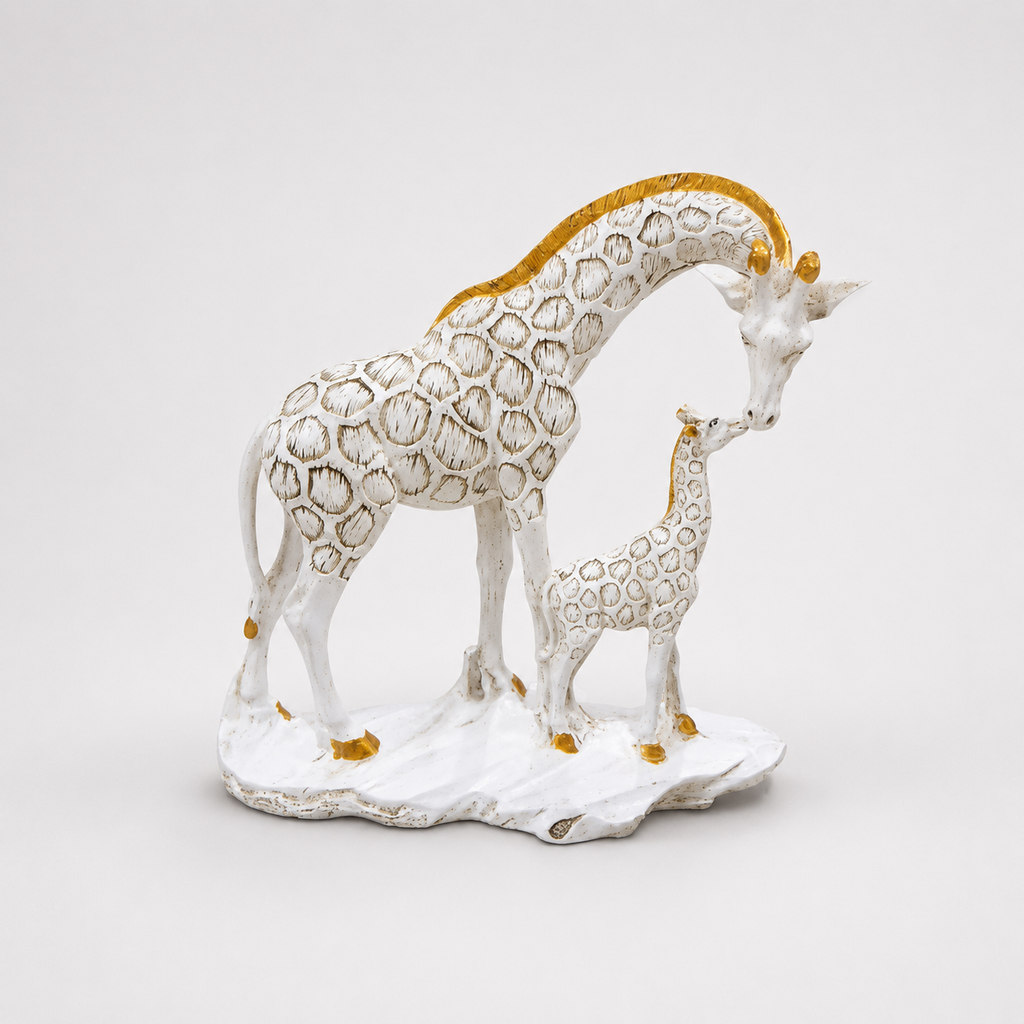 White and gold adult and calf giraffe decorative sculpture, front view