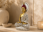 Antique gold and ivory halo Buddha sculpture styled on a console