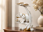 Golden Canopy ivory elephant family sculpture styled on a wood console