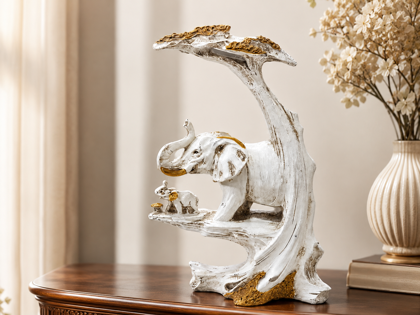 Golden Canopy ivory elephant family sculpture styled on a wood console