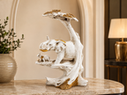 Golden Canopy ivory elephant family sculpture styled on a marble table