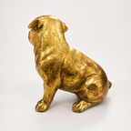 Golden sitting pug decorative sculpture, back view