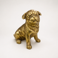 Golden sitting pug decorative sculpture, front view