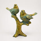 Antique teal and gold pair of songbirds on a branch sculpture, angled view