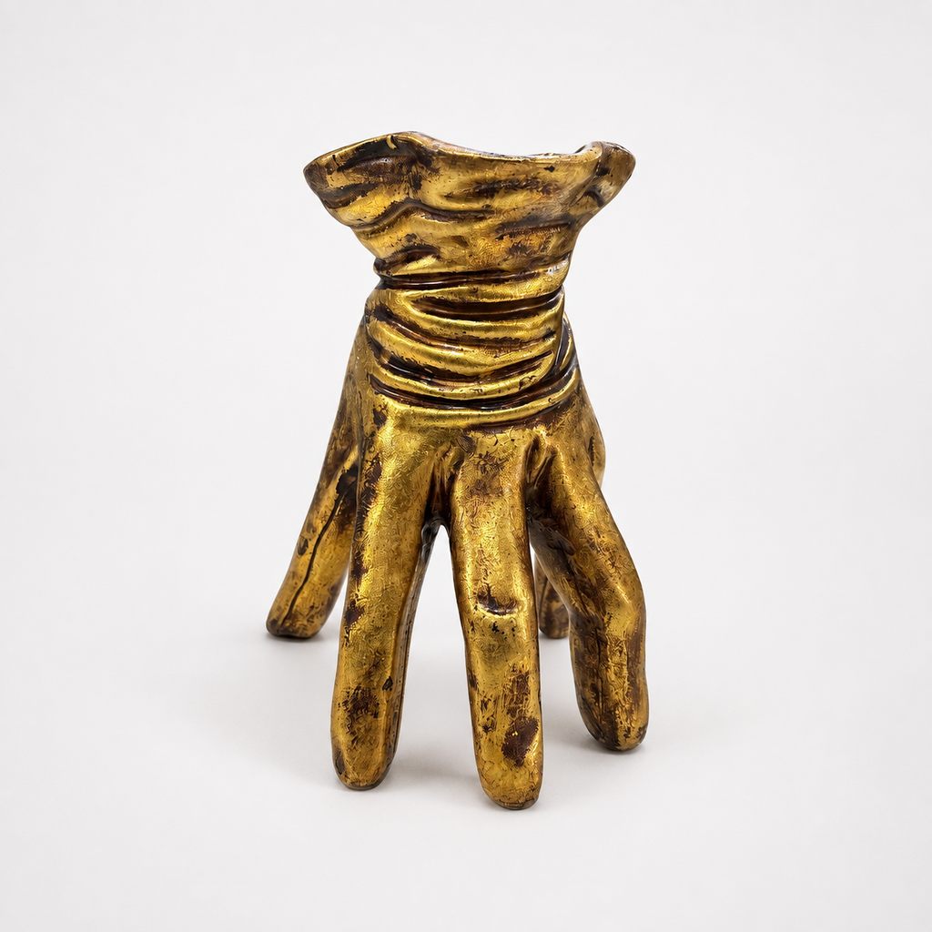 Golden hand-shaped decorative pot, front view