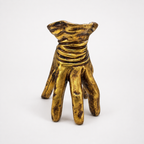 Golden hand-shaped decorative pot, front view