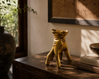 Golden Gesture hand-shaped decorative pot styled on a console