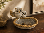 Golden and ivory owl duo decorative tray styled on a console