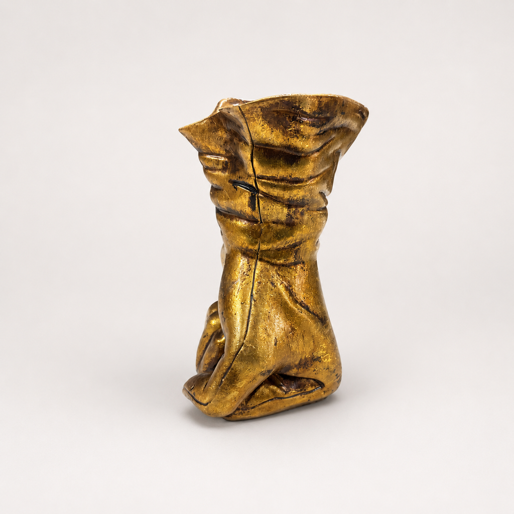 Golden Resolve sculpted hand decorative accent, angled view