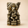 Heritage Grace Ganesha idol with an ivory-tone antique-style finish, gold-tone accents and an ornate backdrop, front view