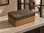 Closed wooden keepsake box with patterned lid on a stone entryway console