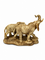 Rear view of ivory and gold elephant family decorative sculpture