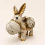Antique ivory and gold traveller donkey sculpture with saddlebags, angled view