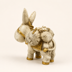 Antique ivory and gold traveller donkey sculpture with saddlebags, rear view