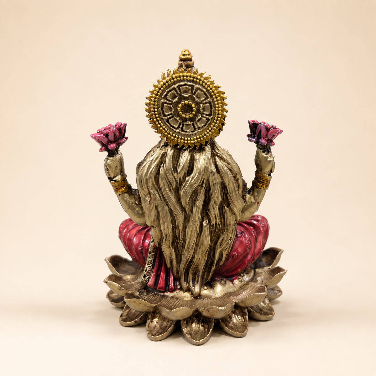 Rear view of the Lotus Abundance Lakshmi idol showing flowing hair, a patterned circular halo and the layered lotus pedestal