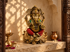 Lotus Blessings Ganesha idol in a sunlit prayer alcove beside a lamp and flowers