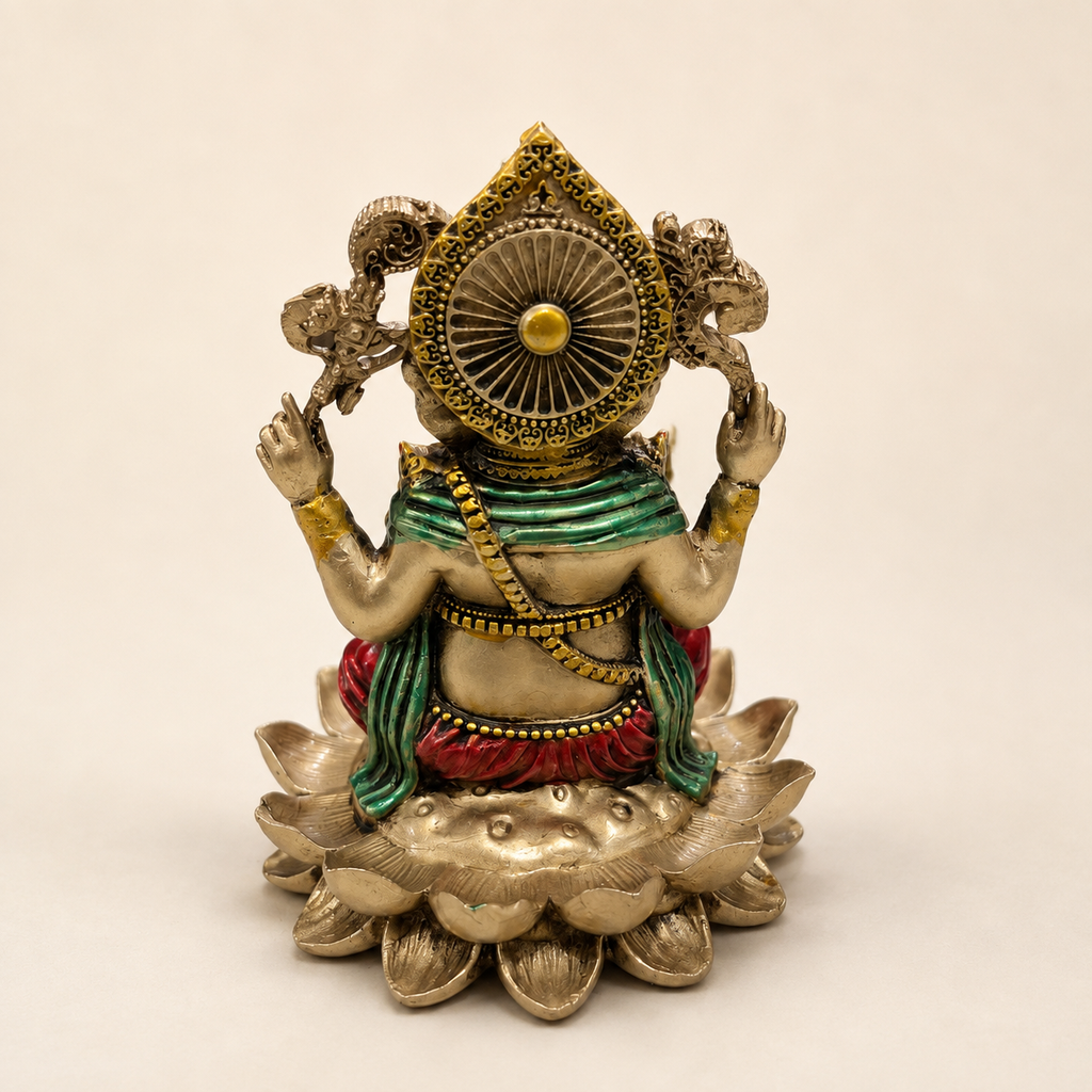 Rear view of the Lotus Blessings Ganesha idol showing the ornate halo, green drape and layered lotus pedestal