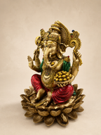 Angled view of the Ganesha idol showing the bowl of sweets, detailed jewellery and layered lotus pedestal
