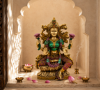 Lotus Radiance Lakshmi idol in a sunlit arched prayer alcove with lamps, pink petals and incense