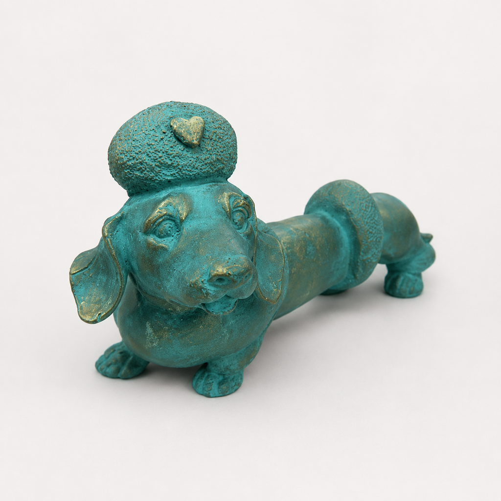 Turquoise and gold dachshund decorative sculpture, front angled view