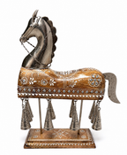 Ornate horse sculpture with wood-look finish, silver-toned accents and hanging bells