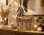 Ornate horse sculpture with hanging bells styled on a wooden console