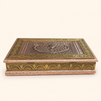 Low angled view of the Mayur Darbar jewellery box showing its peacock lid and ornate gold-tone sides