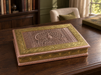 Mayur Darbar copper and gold-tone peacock jewellery box displayed on a dark wooden desk