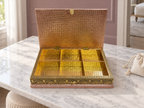 Open six-compartment Mayur Darbar jewellery organiser displayed on a marble vanity